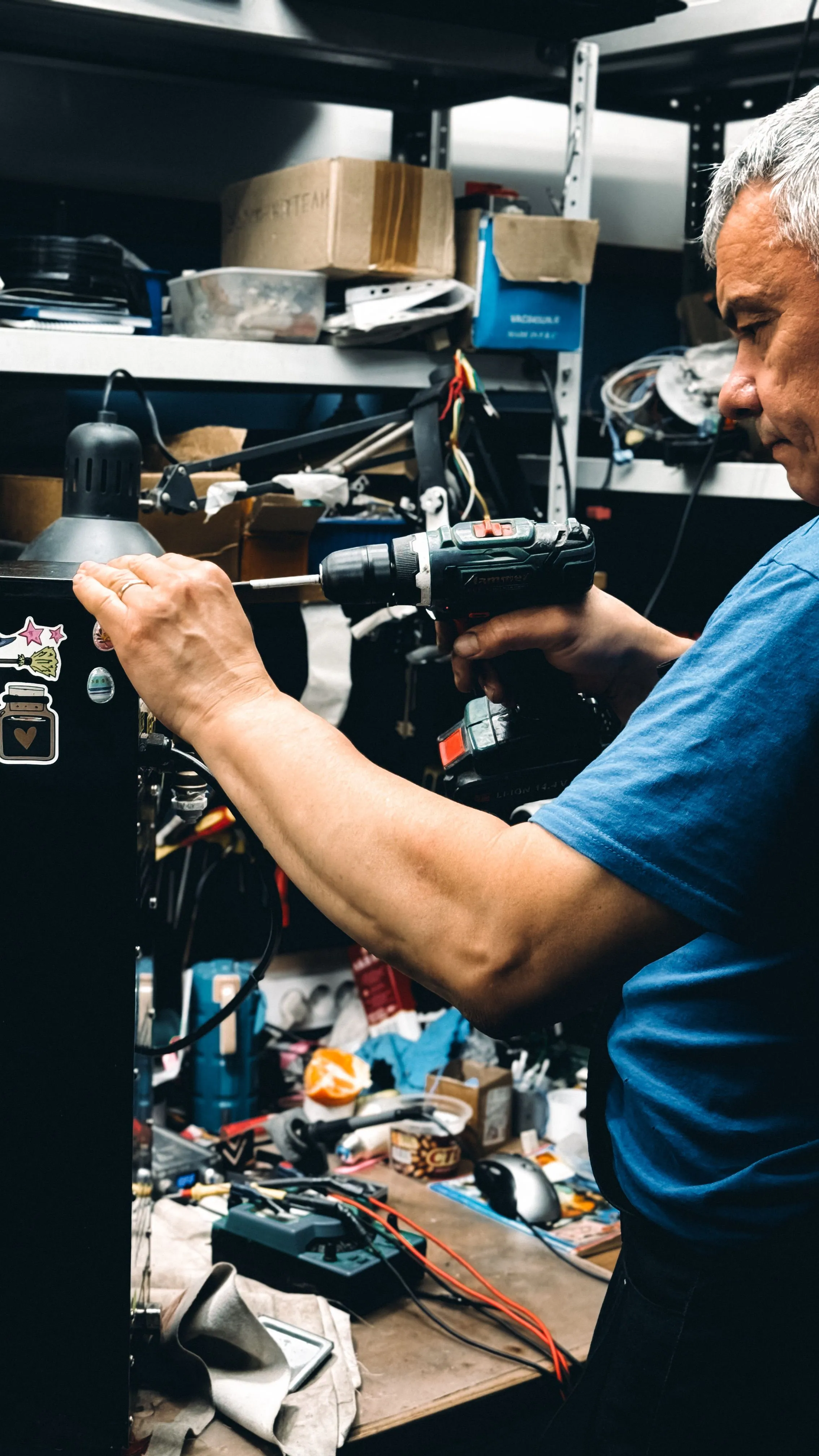 Technician using a power drill during an installation